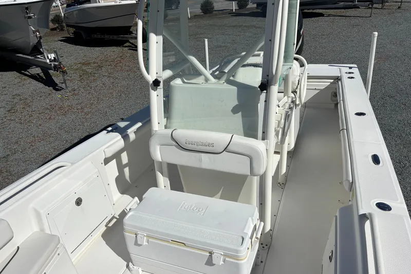 Slide: The Image of 2008 Everglades 243 Center Console boat interior with seating and cooler. - 17
