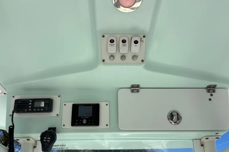 Slide: The Image of 2008 Everglades 243 Center Console boat dashboard with radio and control panel. - 6