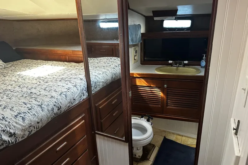 Slide: The Image of 1975 Morgan Out Island 51 yacht interior with cozy bedroom and compact bathroom. - 28