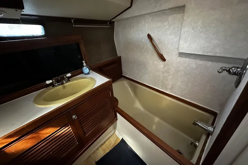 Slide: The Image of Bathroom interior of 1975 Morgan Out Island 51 yacht with sink and bathtub. - 31