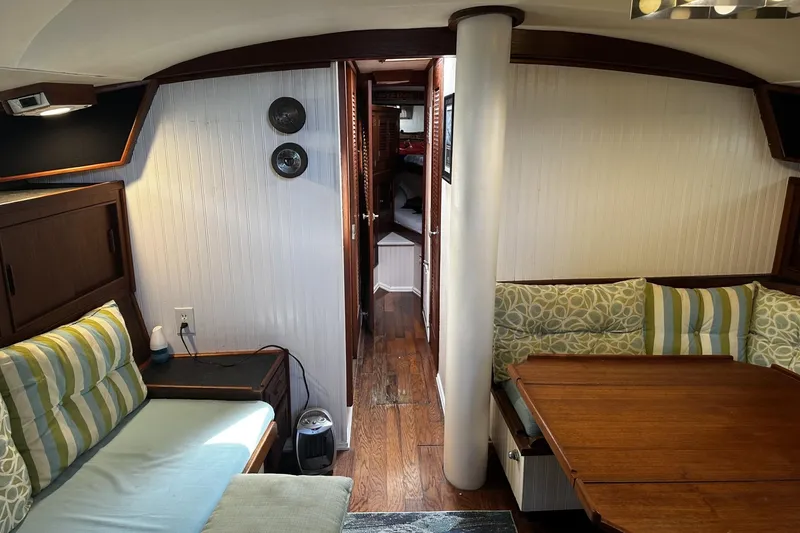 Slide: The Image of Interior of a 1975 Morgan Out Island 51 yacht with cozy seating and wooden accents. - 33