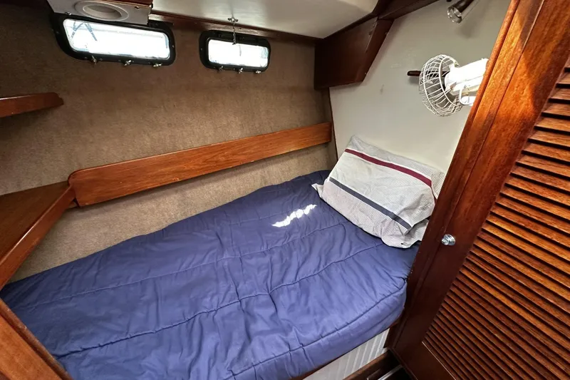 Slide: The Image of Cozy cabin interior of 1975 Morgan Out Island 51 sailboat with wooden accents. - 35