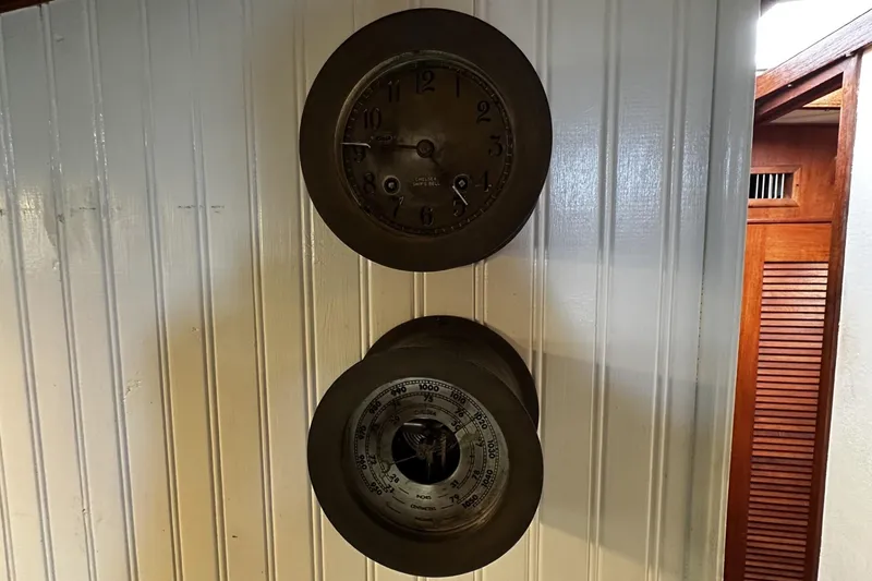 Slide: The Image of Vintage nautical clock and barometer on 1975 Morgan Out Island 51 yacht interior. - 51