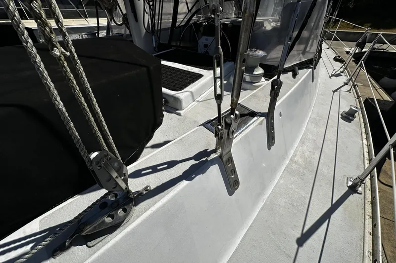 Slide: The Image of 1975 Morgan Out Island 51 sailboat deck with rigging and hardware details. - 63