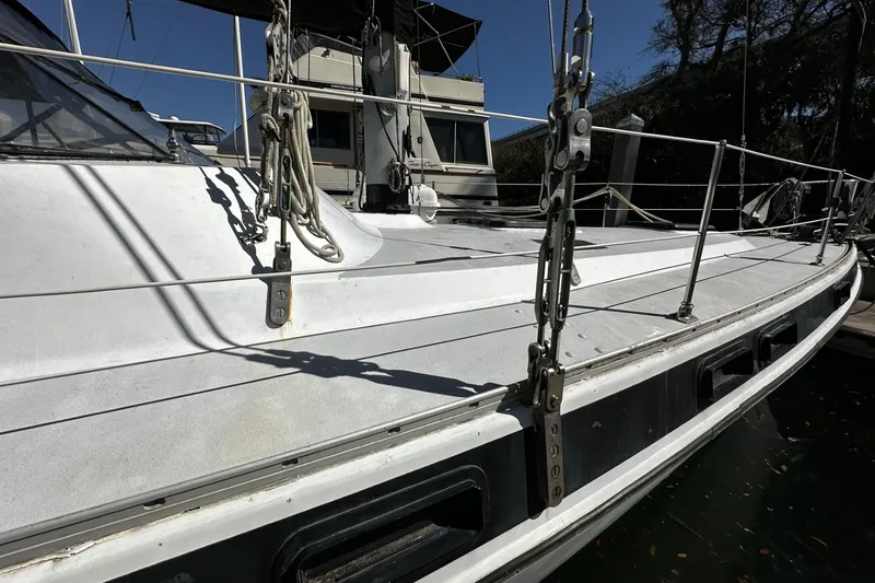 Slide: The Image of 1975 Morgan Out Island 51 sailboat deck with rigging and railings. - 64