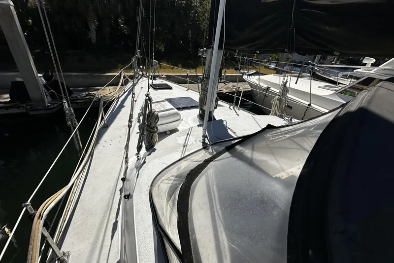 Slide: The Image of 1975 Morgan Out Island 51 sailboat docked, showcasing deck and rigging details. - 66