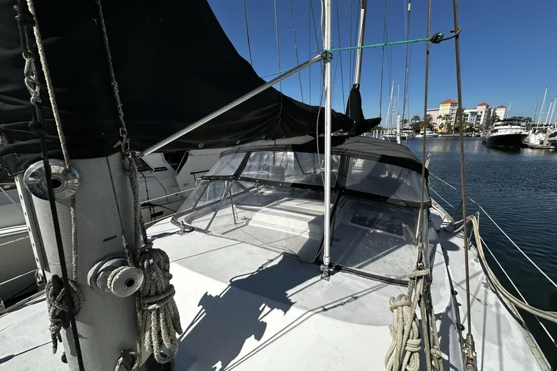 Slide: The Image of 1975 Morgan Out Island 51 sailboat docked in a sunny marina. - 70