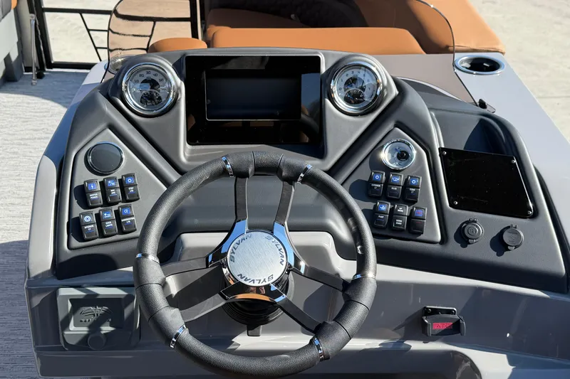 Slide: The Image of Steering console of 2026 Sylvan L-1 LZ DH boat with modern controls and gauges. - 10