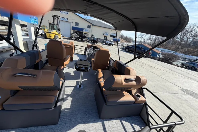 Slide: The Image of Interior of 2026 Sylvan L-1 LZ DH pontoon boat with tan seating and canopy. - 8
