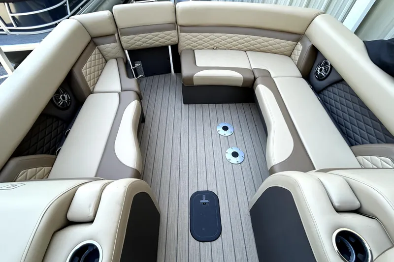 Slide: The Image of Luxurious seating area on 2026 Godfrey Monaco 255 ULC pontoon boat, featuring premium upholstery. - 10