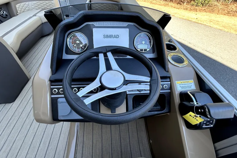 Slide: The Image of Steering console of 2026 Godfrey Monaco 255 ULC boat with Simrad display. - 6