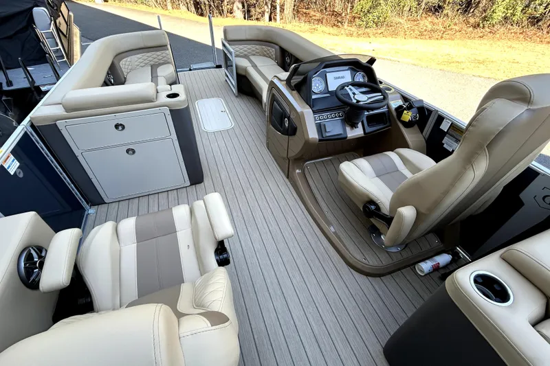 Slide: The Image of Luxurious interior of 2026 Godfrey Monaco 255 ULC pontoon boat with plush seating and modern helm. - 7