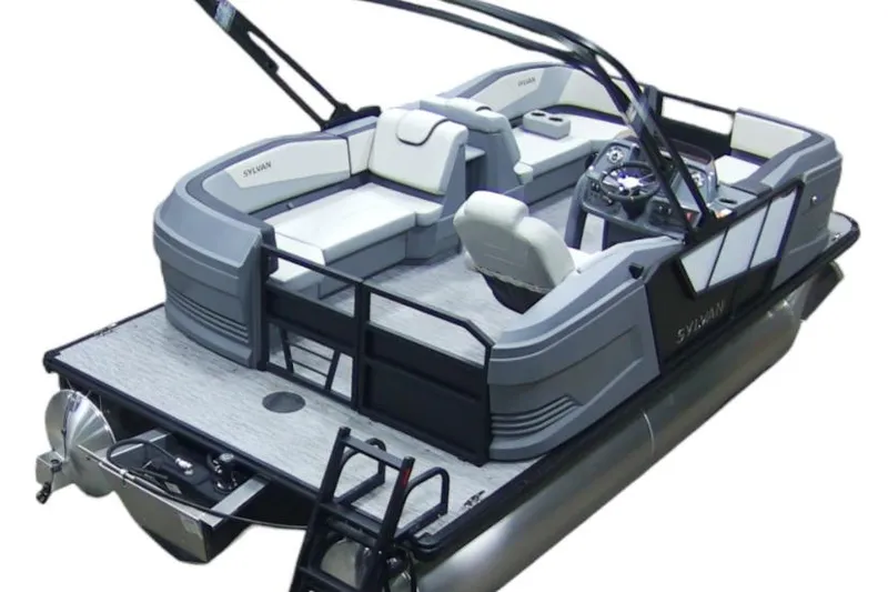 The Image of 2026 Sylvan A-18 pontoon boat with canopy, parked outdoors on concrete. - 0