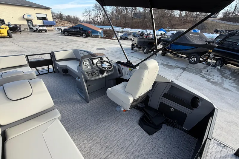 Slide: The Image of Interior view of 2026 Sylvan A-18 boat, featuring modern seating and control panel. - 6