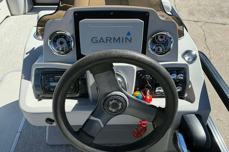 Slide: The Image of Steering console of 2020 Avalon GS Quad Lounger with Garmin navigation system. - 10