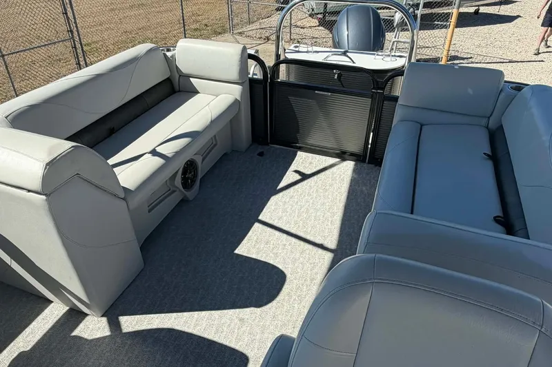 Slide: The Image of 2020 Avalon GS Quad Lounger boat interior with gray seating and spacious layout. - 14