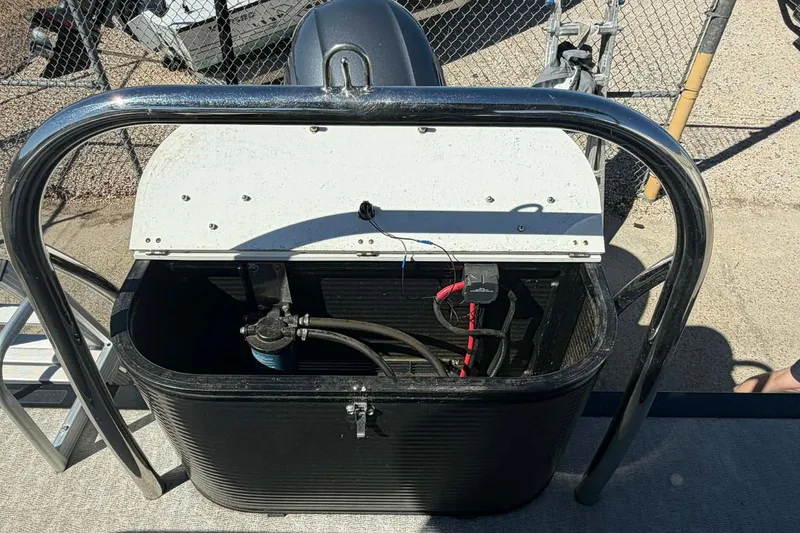 Slide: The Image of 2020 Avalon GS Quad Lounger boat engine compartment with open cover, showing internal components. - 15