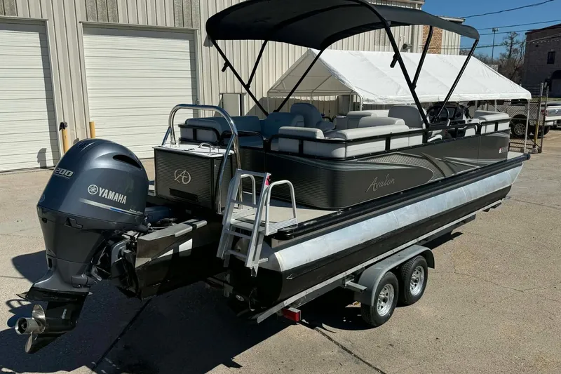 Slide: The Image of 2020 Avalon GS Quad Lounger 23' pontoon boat with Yamaha engine on trailer. - 6