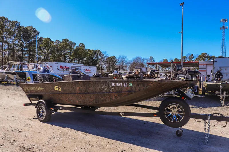 The Image of 2024 G3 Gator Tough 17 SC boat on trailer in outdoor lot. - 0