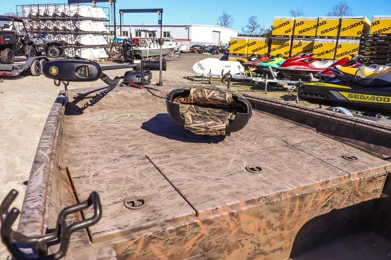 Slide: The Image of 2024 G3 Gator Tough 17 SC boat with camouflage deck, outdoor display. - 10