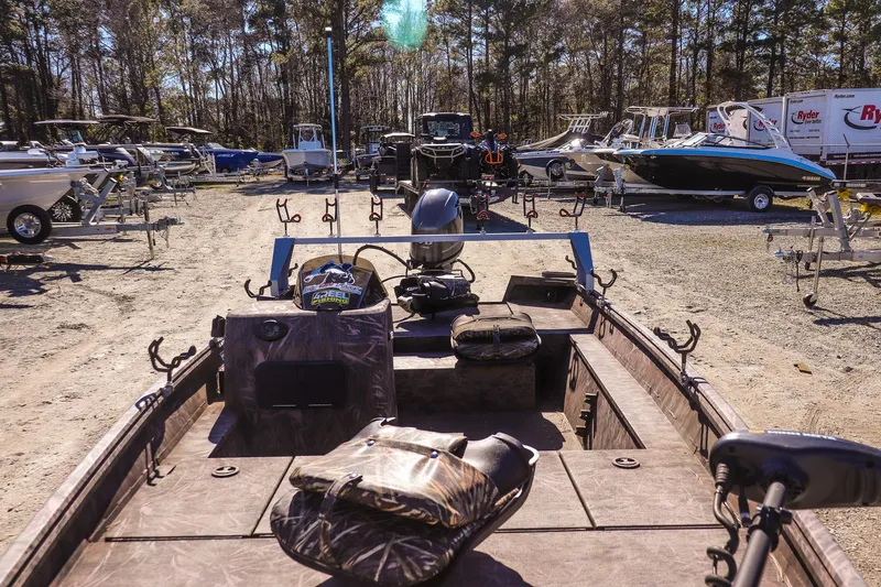 Slide: The Image of 2024 G3 Gator Tough 17 SC boat in a dealership lot with other boats. - 13