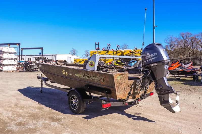 Slide: The Image of 2024 G3 Gator Tough 17 SC boat with Yamaha motor in outdoor setting. - 4