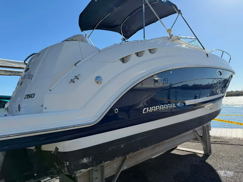 Slide: The Image of 2008 Chaparral Signature 250 boat docked under sunny skies. - 2