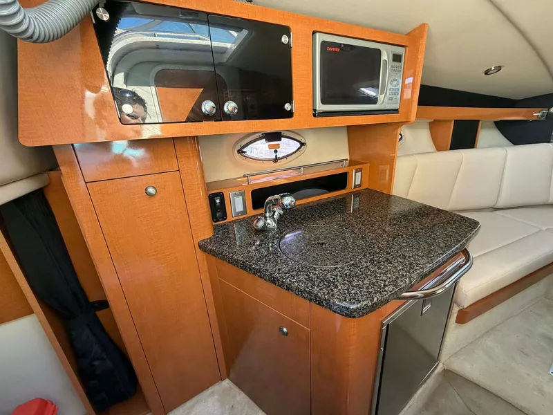 Slide: The Image of Interior of 2008 Chaparral Signature 250 yacht kitchen area. - 23