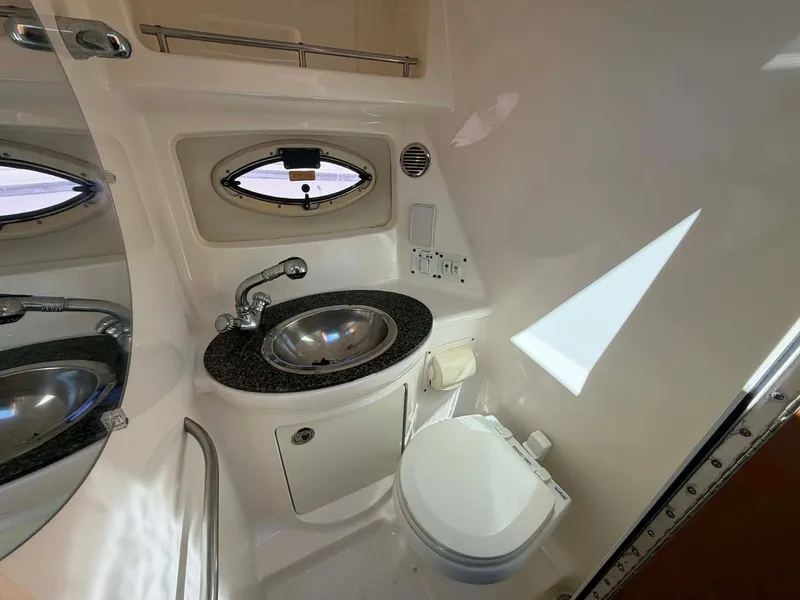 Slide: The Image of Interior of Chaparral Signature 250 yacht, bathroom with sink and toilet. - 25