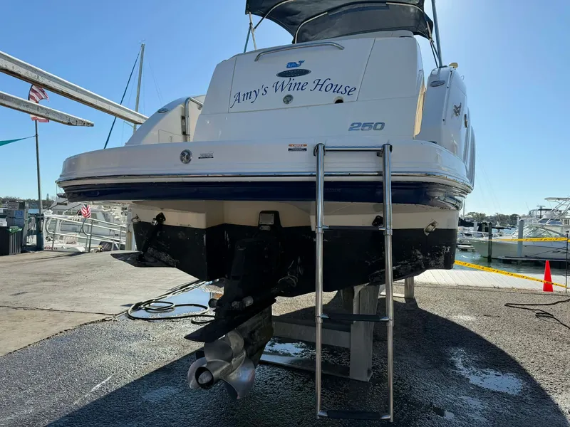 Slide: The Image of 2008 Chaparral Signature 250 boat at dock with ladder. - 34
