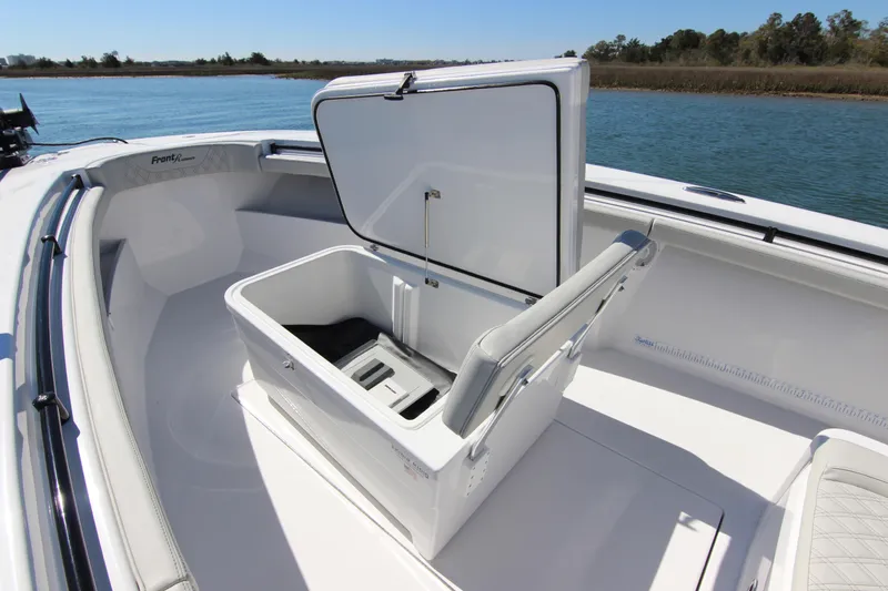 Slide: The Image of 2024 Front Runner 33 Center Console boat with luxurious seating and dual Mercury engines. - 15