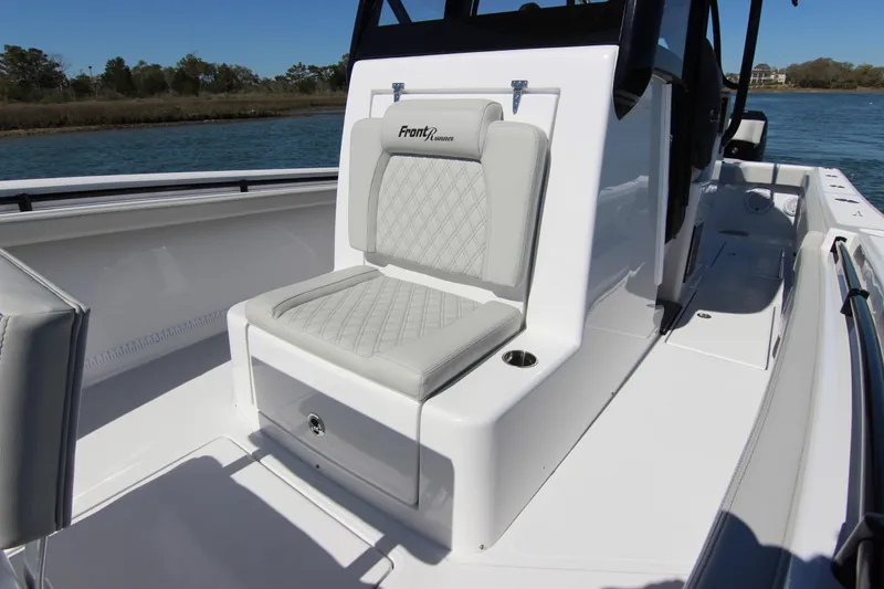 Slide: The Image of 2024 Front Runner 33 Center Console with dual Mercury outboard engines on open water. - 16