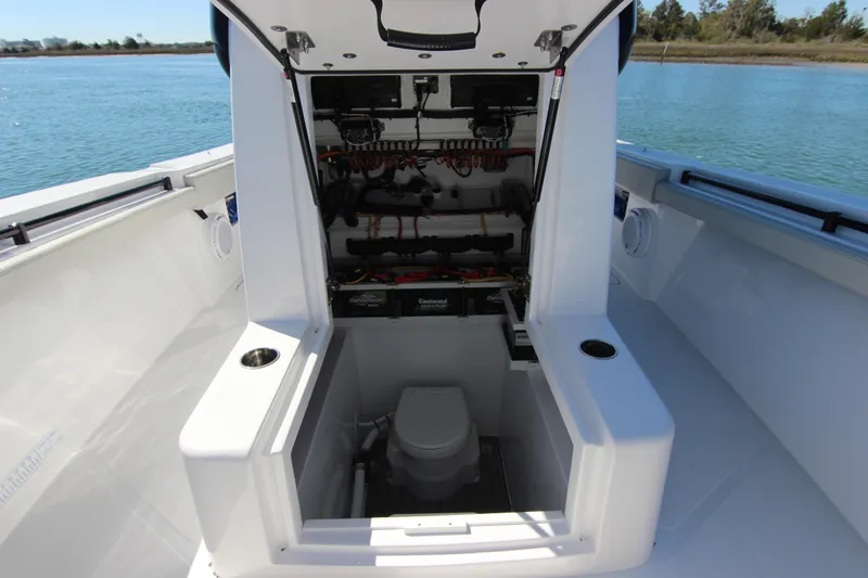 Slide: The Image of 2024 Front Runner 33 Center Console boat interior with modern navigation equipment. - 17