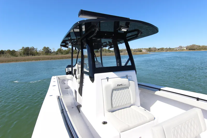 Slide: The Image of 2024 Front Runner 33 Center Console boat dashboard with advanced navigation systems. - 18