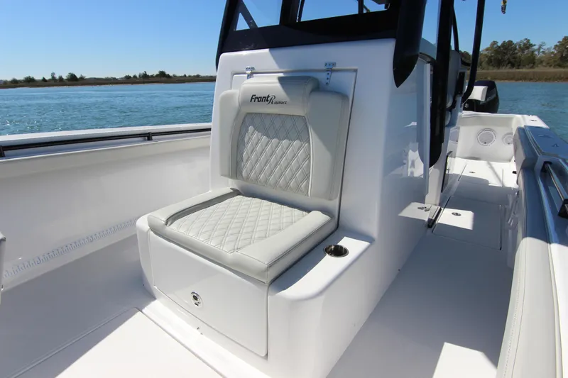 Slide: The Image of 2024 Front Runner 33 Center Console boat dashboard with navigation screens and controls. - 19