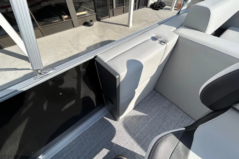 Slide: The Image of 2026 Harris Cruiser 210 interior with sleek gray seating and modern design. - 12