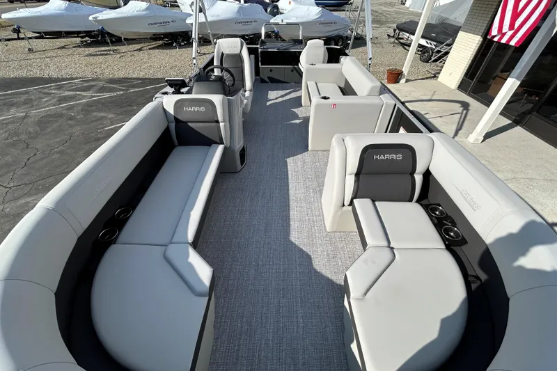 Slide: The Image of 2026 Harris Cruiser 210 pontoon boat interior with spacious seating and modern design. - 16