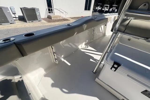 Slide: The Image of 2024 Key West 219 FS boat interior with seating and rod holders. - 14