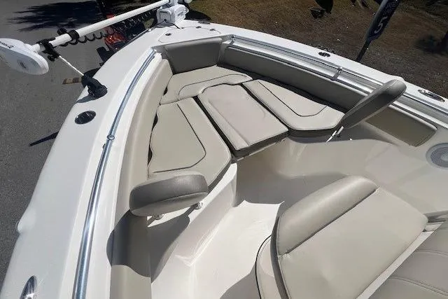 Slide: The Image of 2024 Key West 219 FS boat interior with cushioned seating and modern design. - 16