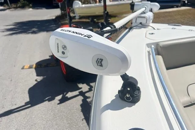 Slide: The Image of 2024 Key West 219 FS boat with Minn Kota trolling motor on deck. - 9