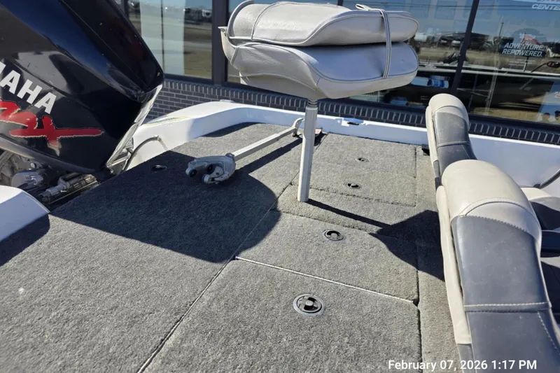 Slide: The Image of 2000 Skeeter SX180 boat deck with Yamaha engine, featuring cushioned seating. - 8