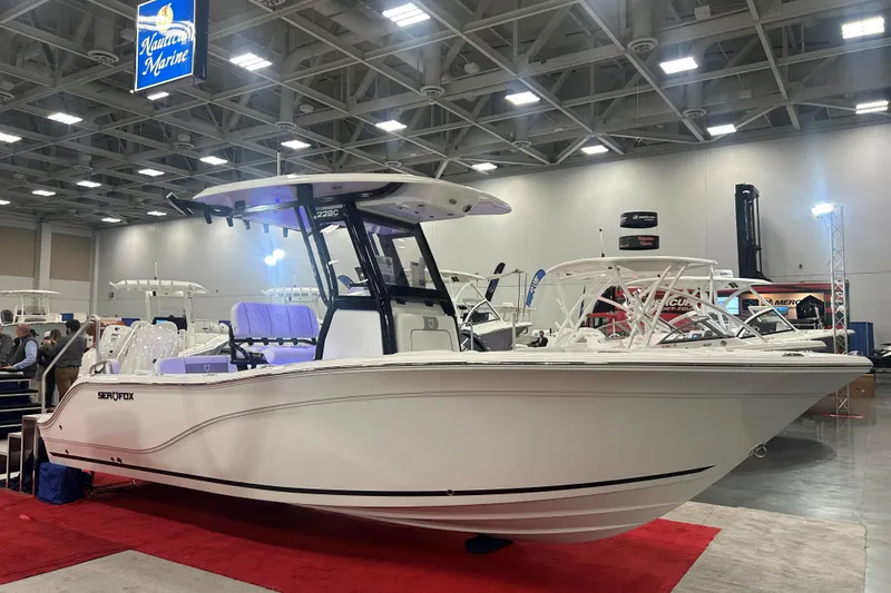 The Image of 2026 Sea Fox 228 Commander boat displayed at indoor marine exhibition. - 0