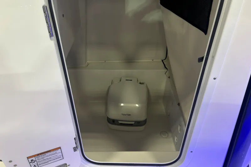 Slide: The Image of 2026 Sea Fox 228 Commander boat interior with compact portable toilet. - 10