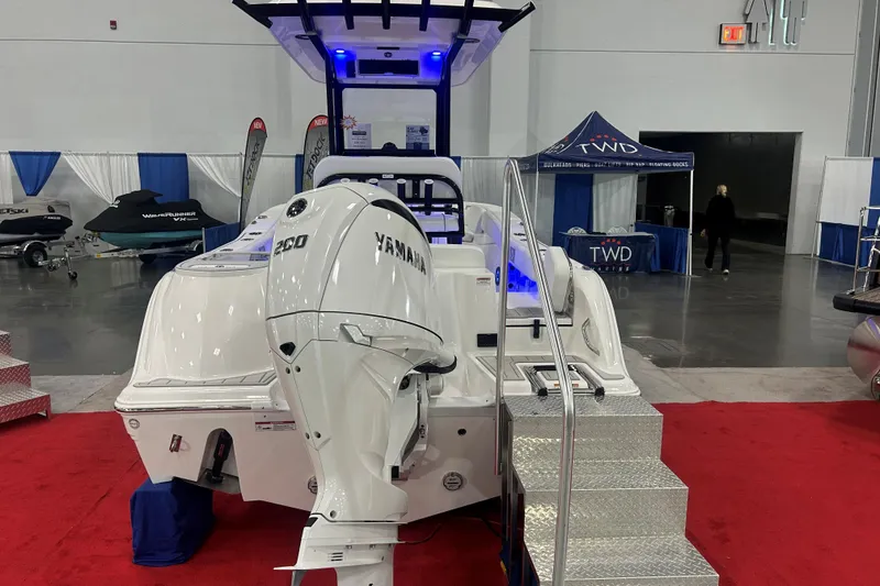 Slide: The Image of 2026 Sea Fox 228 Commander boat with Yamaha engine on display at a boat show. - 3