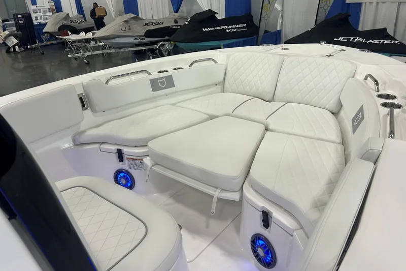 Slide: The Image of 2026 Sea Fox 228 Commander boat interior with white cushioned seating and blue LED lights. - 6