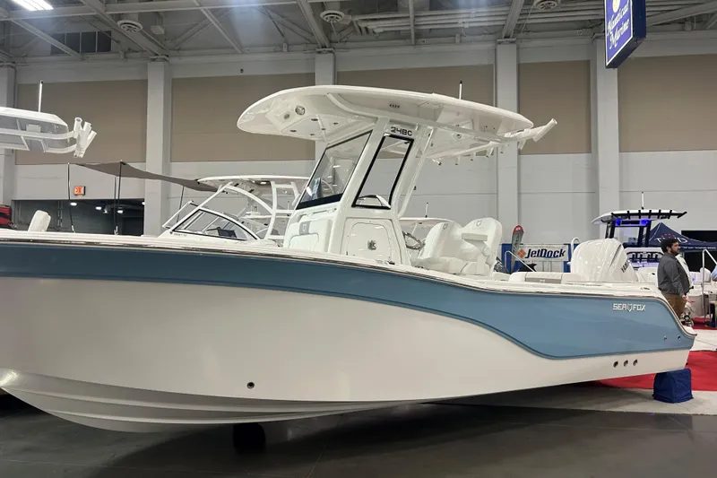 The Image of 2026 Sea Fox 248 Commander boat displayed indoors at a marine exhibition. - 0