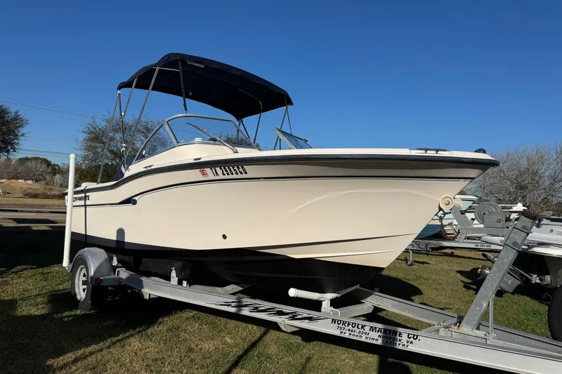 The Image of 2006 Grady-White Tournament 185 boat on trailer, clear sky background. - 1