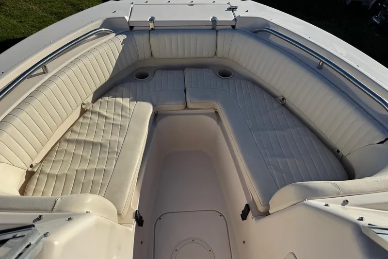 Slide: The Image of 2006 Grady-White Tournament 185 boat interior with cushioned seating and cup holders. - 13