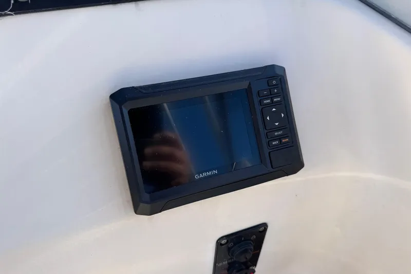 Slide: The Image of Garmin GPS device on 2006 Grady-White Tournament 185 boat dashboard. - 16