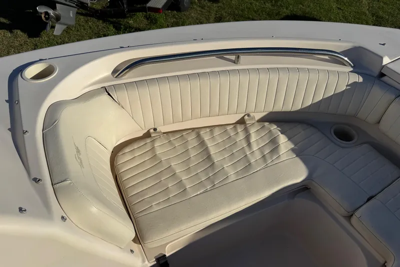 Slide: The Image of 2006 Grady-White Tournament 185 boat interior with cushioned seating and cup holder. - 18